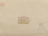 an old envelope with a stamp on it sitting on top of a table