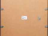 an image of a picture of a picture frame with clips on it