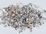 a pile of silver spoons and spoons on a table