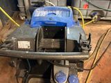 a machine that is sitting on the floor in a room
