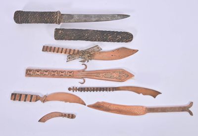 five different types of knifes on a white surface