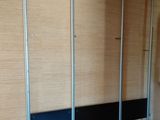a bathroom with a toilet and a urinal on the wall