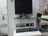 an image of a computer desk with a monitor and keyboard on it