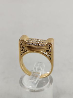 a close up of a gold ring with diamonds on it