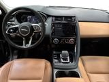 the interior of a car with tan leather seats and steering controls