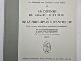 a close up of a book on a table with a white background
