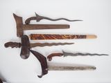 five different types of knifes on a white surface
