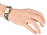 an image of a woman ' s wrist with a watch on it