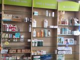 a pharmacy shop with a lot of products on the shelves