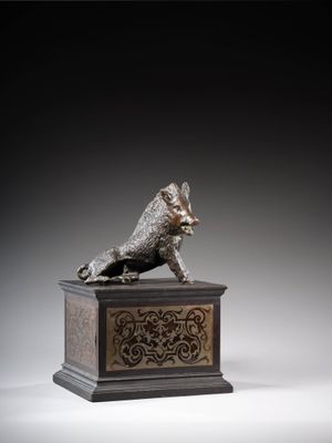 an image of a bronze statue of a dog on a pedestal