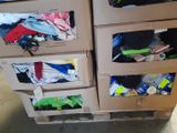 several boxes of clothes are stacked on top of each other