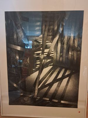 a black and white photo of a staircase in a room
