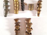 a lot of different types of brass fittings on a white surface