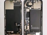 the back of a cell phone with a broken battery and a broken battery