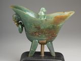 an image of a sculpture of a bird on a stand