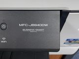 a close up of a printer on a desk with a mouse on it