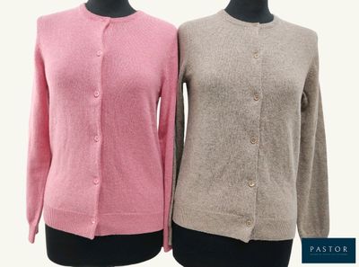 two women ' s sweaters on a mannequin mannequin mannequin mannequin mannequin mannequin mannequin mannequin