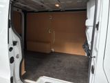 a white van with the door open in a garage