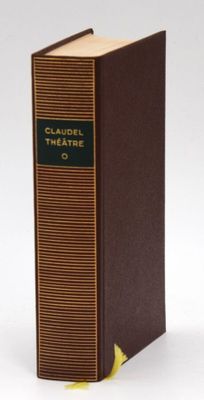 the book is brown and green with a yellow ribbon around it