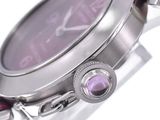 the watch has a purple dial on the face of the watch