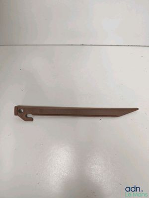 a wooden shelf with a metal handle on it