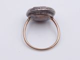 a close up of a ring with a stone on it
