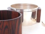 two wooden cups sitting next to each other on a table