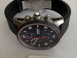a watch that is on a table with a price tag