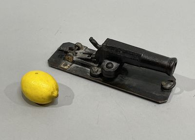 an image of a lemon and a machine on a table