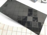 a picture of a remote control, a keyboard and a calculator on a table