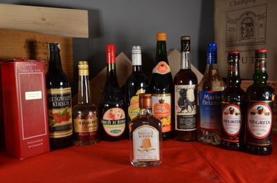many bottles of alcohol sitting on a red table