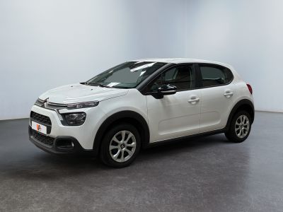 a white citrole is parked in a white room