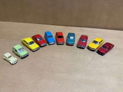 several toy cars are lined up in a row on a table