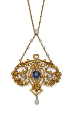 un gros plan d'un collier orné d'une pierre bleue et de perles