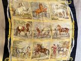 an image of a scarf with horses and jockeys on it