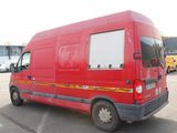 a red van that is parked in a parking lot