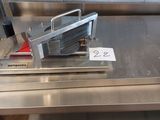 a machine that is sitting on top of a metal table