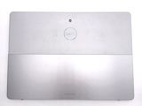 a silver dell laptop sitting on a white surface