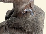 a close up of a statue of a man with a hat on
