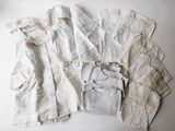 a pile of white clothing on a white surface