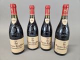 three bottles of wine are lined up on a table
