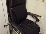 a black leather office chair with a label on it