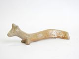 figurine of a dachshund on a white background