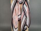 a pink and black plaid scarf on a mannequin mannequin mannequin mannequin mannequin mannequin mannequin mannequin