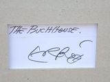 a sign that says the beach house on the side of a building
