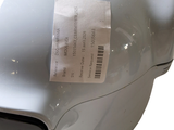 a silver machine with a price tag on it