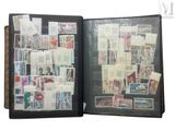 a black folder with stamps on it and a picture of a man