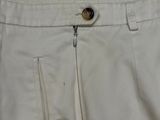 the back of a pair of white pants with a zipper down the side