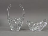 two clear glass vases sitting next to each other