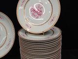 many plates stacked on top of each other on a table